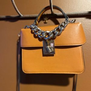 Small tan purse with silver chain